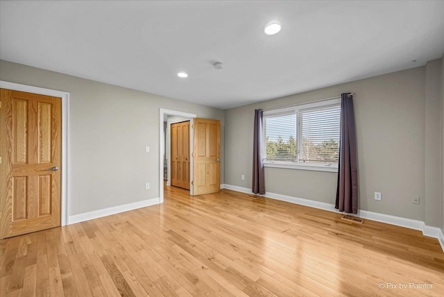 unfurnished bedroom featuring light wood-type flooring