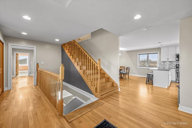 hall with light hardwood / wood-style flooring