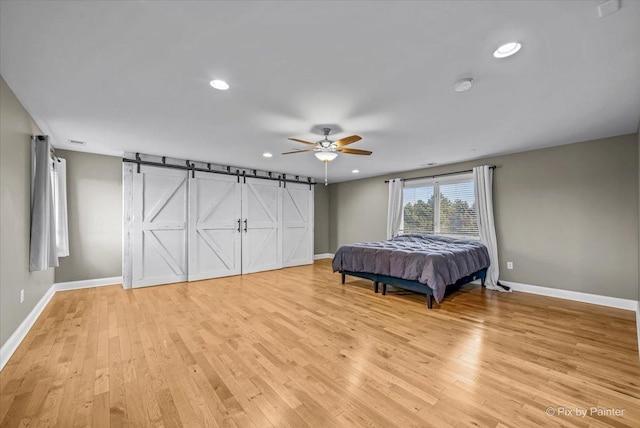 unfurnished bedroom featuring ceiling fan and light hardwood / wood-style floors