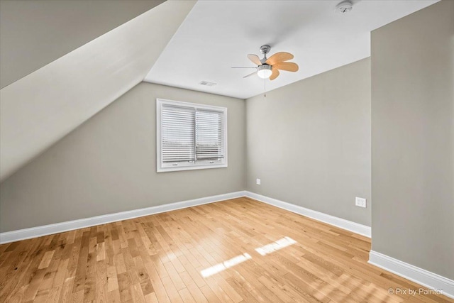 bonus room with light hardwood / wood-style floors, ceiling fan, and lofted ceiling