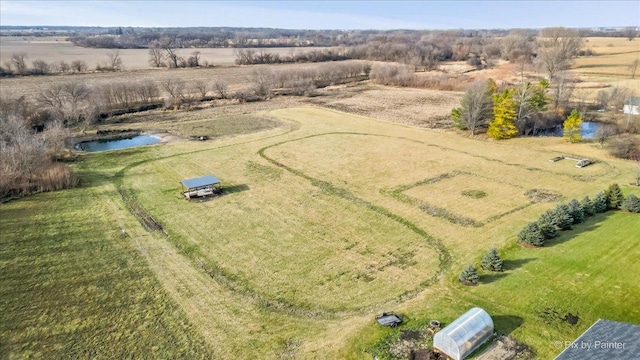 drone / aerial view with a rural view and a water view