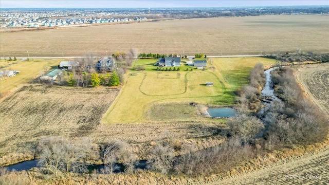 birds eye view of property with a rural view