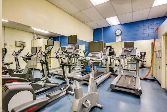 exercise room with a drop ceiling