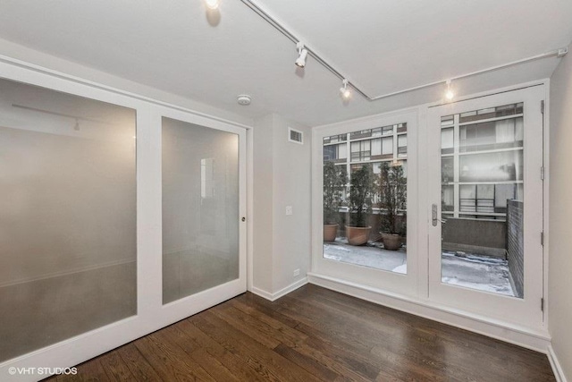 spare room with dark hardwood / wood-style floors