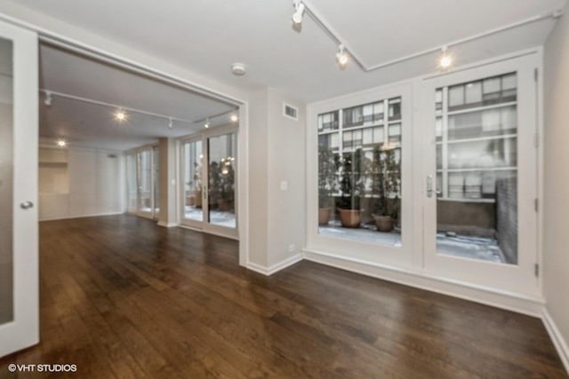 spare room featuring dark hardwood / wood-style floors