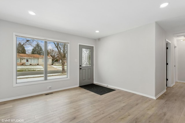 foyer entrance with light hardwood / wood-style flooring