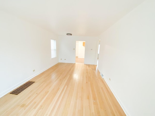 spare room featuring light hardwood / wood-style flooring