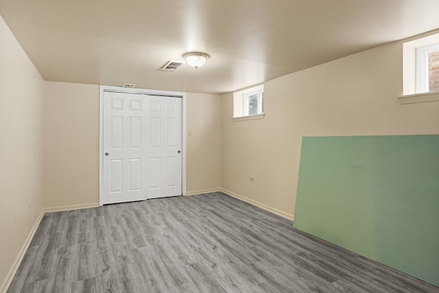 basement featuring light hardwood / wood-style floors