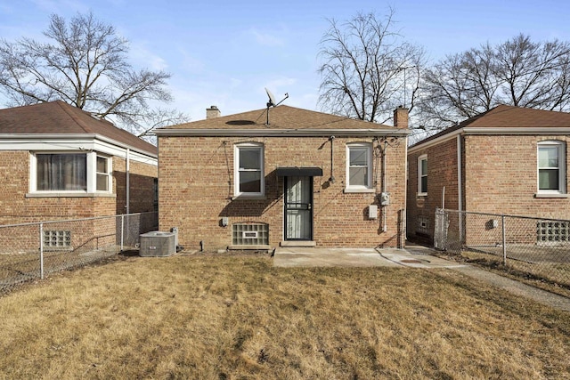 back of property featuring a yard, central AC, and a patio area