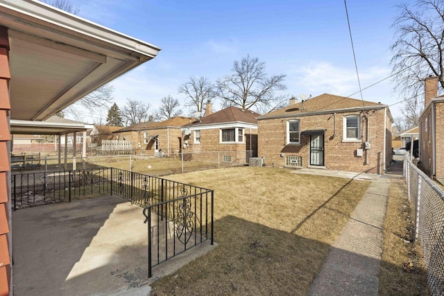 view of yard featuring a patio area and central air condition unit