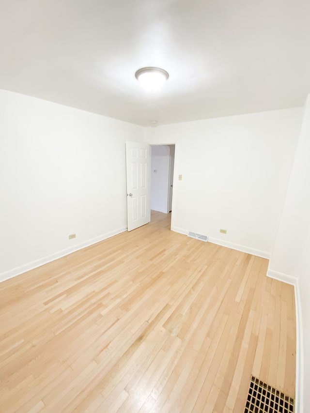 empty room with light hardwood / wood-style floors