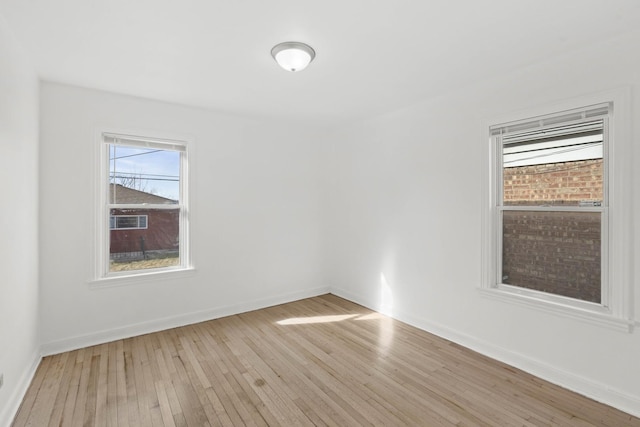 unfurnished room with light hardwood / wood-style flooring