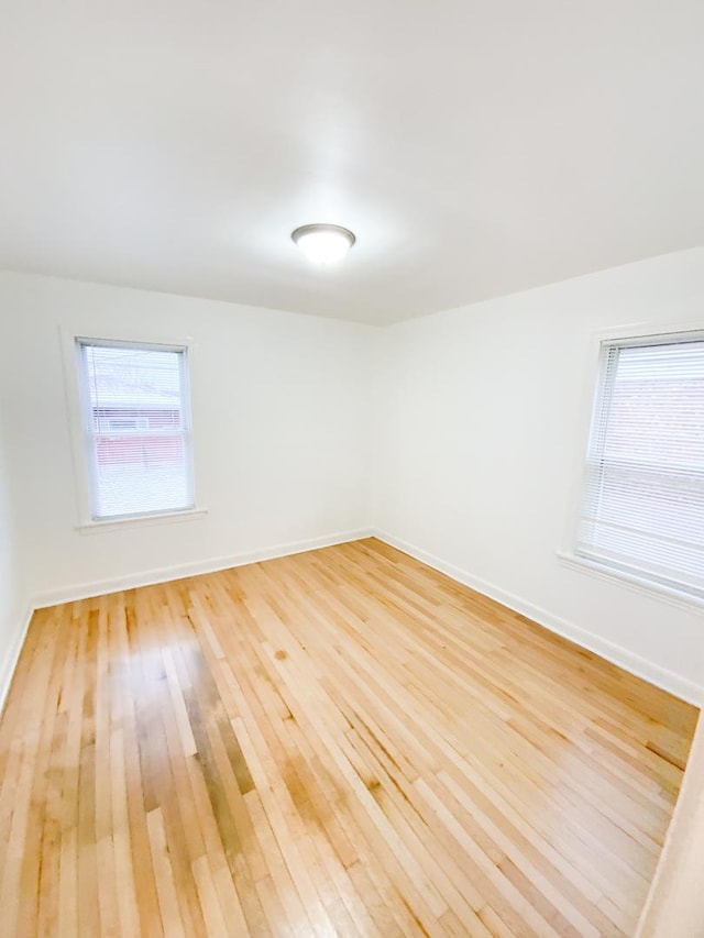 unfurnished room featuring wood-type flooring