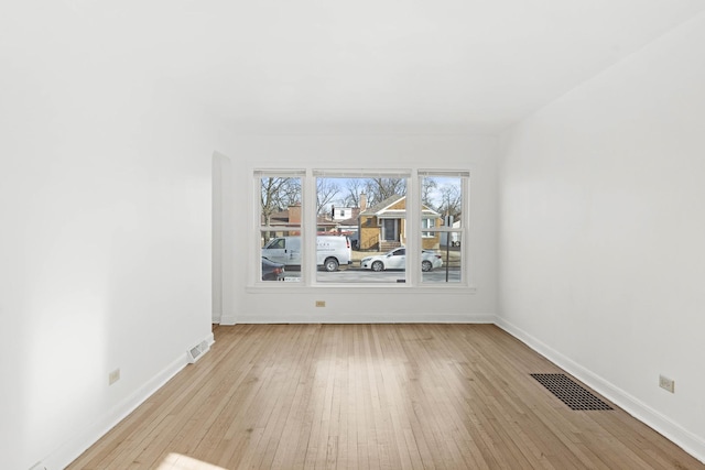 unfurnished room with light hardwood / wood-style flooring