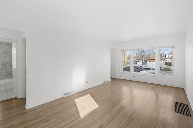 unfurnished living room with light hardwood / wood-style flooring