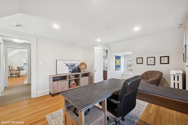 office with light wood-style floors, recessed lighting, vaulted ceiling, and baseboards