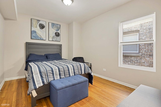 bedroom with hardwood / wood-style floors