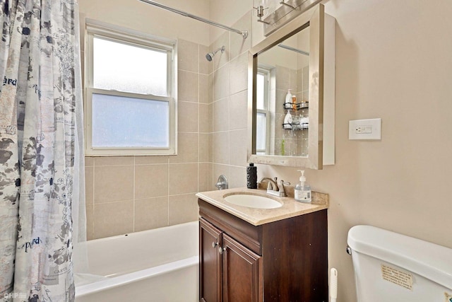 full bathroom with vanity, toilet, and shower / tub combo with curtain