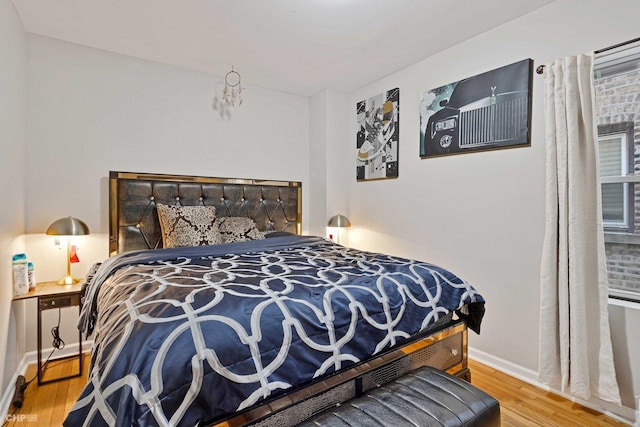 bedroom with hardwood / wood-style floors