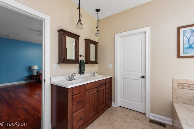 bathroom featuring tile patterned floors and vanity