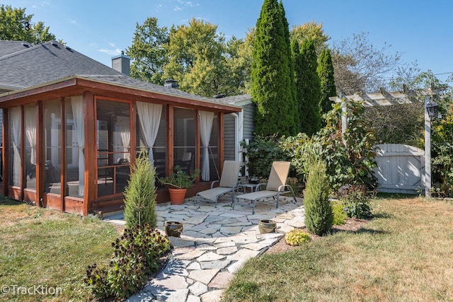 view of yard with a patio area and a sunroom