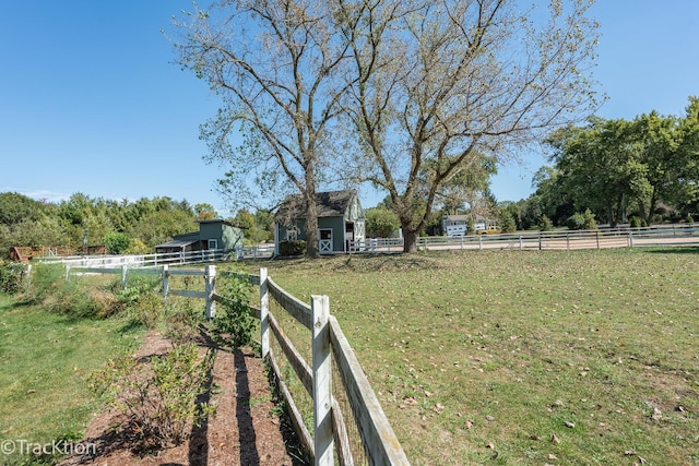 view of yard with a rural view