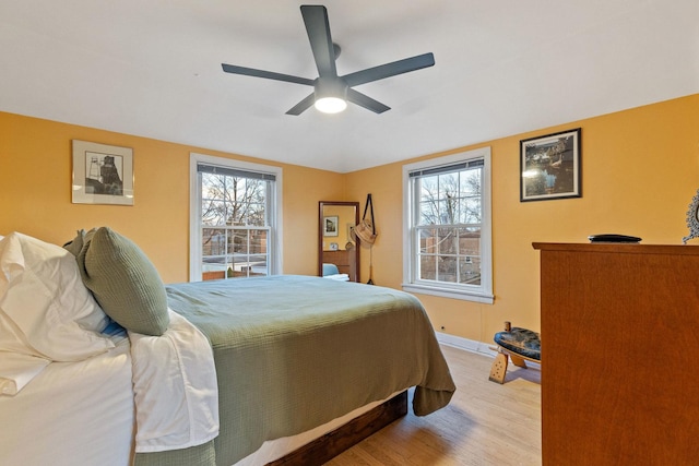 bedroom featuring hardwood / wood-style floors and ceiling fan