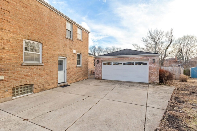 view of side of property with a garage and an outdoor structure