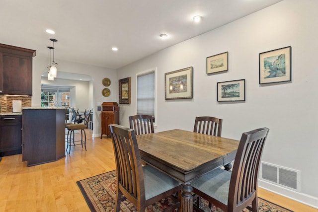 dining area featuring light wood-type flooring