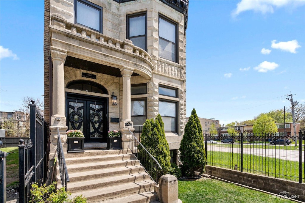 view of exterior entry featuring french doors