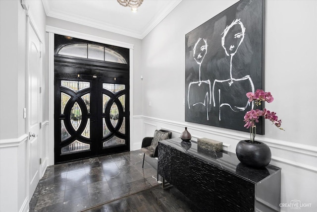 entrance foyer featuring french doors and ornamental molding