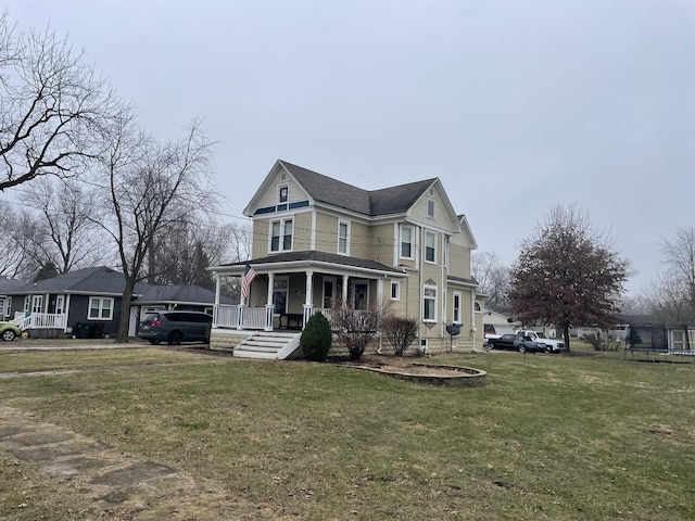 victorian home with covered porch and a front lawn