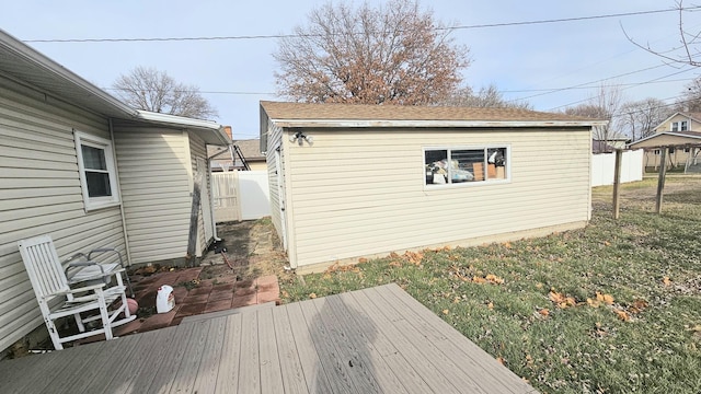 wooden terrace with an outbuilding