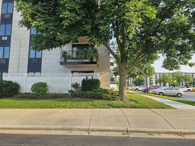 view of property featuring uncovered parking