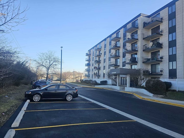 view of property featuring uncovered parking