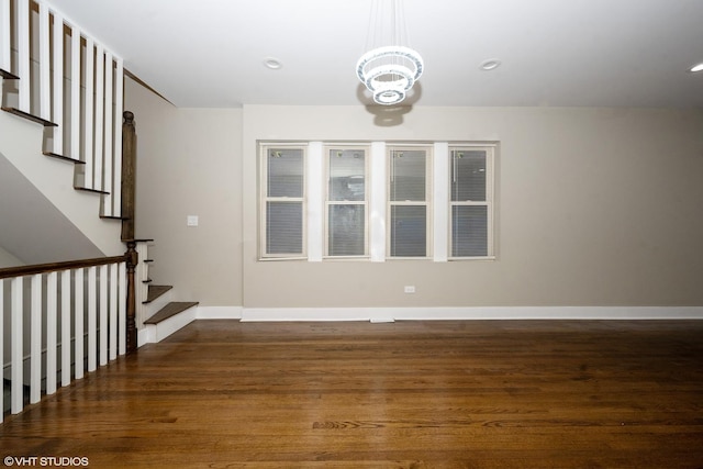 interior space featuring a notable chandelier and dark hardwood / wood-style floors