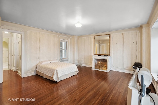 bedroom featuring dark hardwood / wood-style flooring