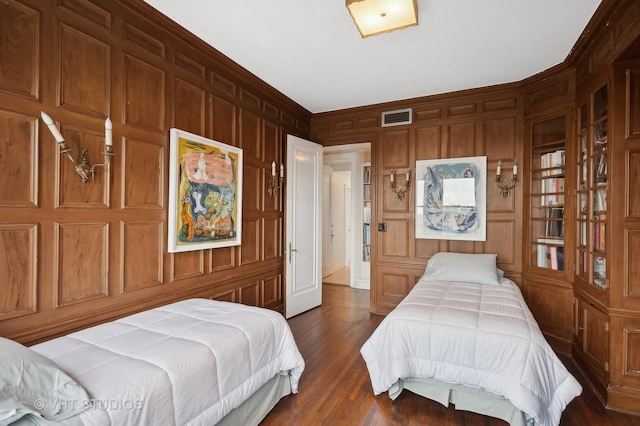 bedroom with dark wood-type flooring