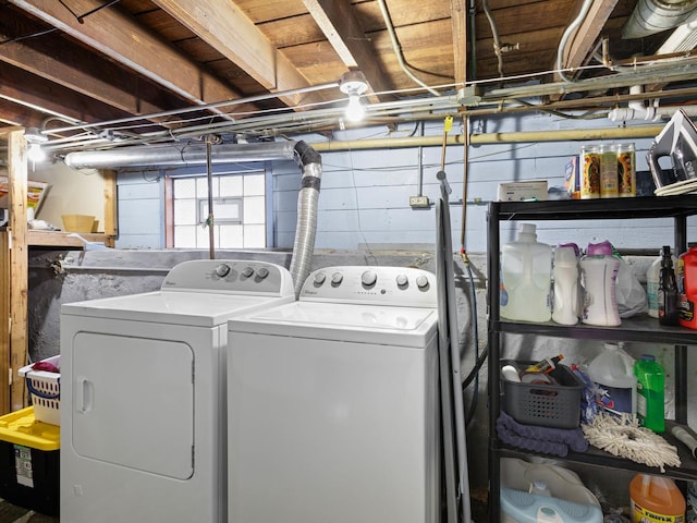 washroom with washing machine and clothes dryer