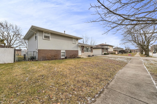 view of home's exterior featuring a yard and a garage