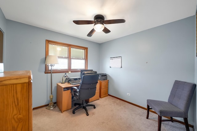 office featuring ceiling fan and light colored carpet