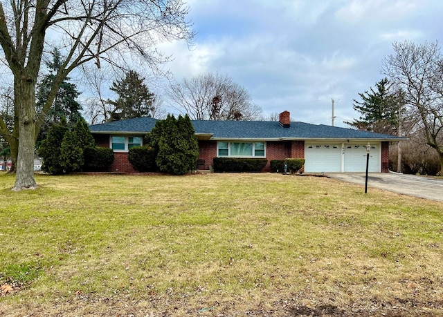 single story home featuring a front lawn and a garage