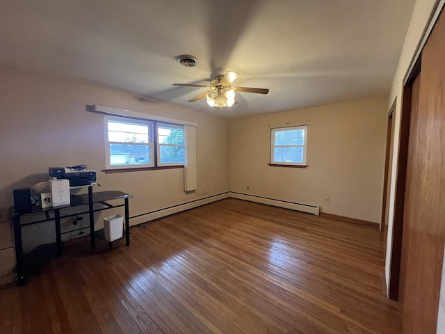 unfurnished bedroom featuring ceiling fan, a closet, and dark wood-type flooring