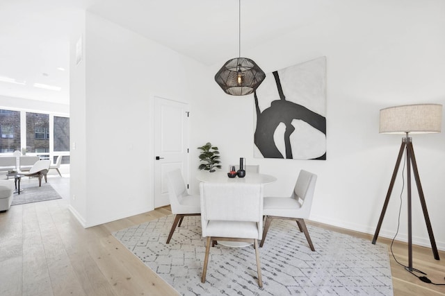 dining area featuring light wood-type flooring