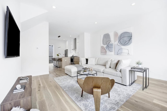 living room with light hardwood / wood-style floors