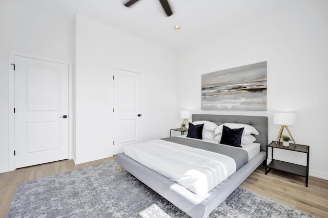 bedroom with hardwood / wood-style flooring and ceiling fan