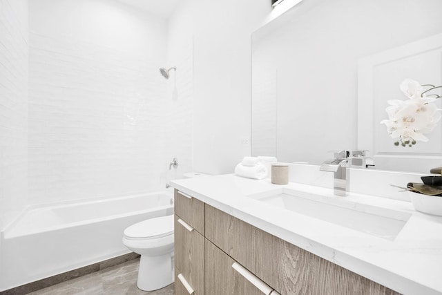 full bathroom featuring bathing tub / shower combination, vanity, and toilet