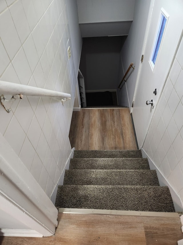 stairway featuring hardwood / wood-style flooring