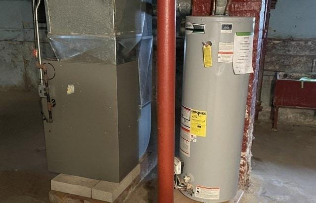 utilities featuring gas water heater and heating unit