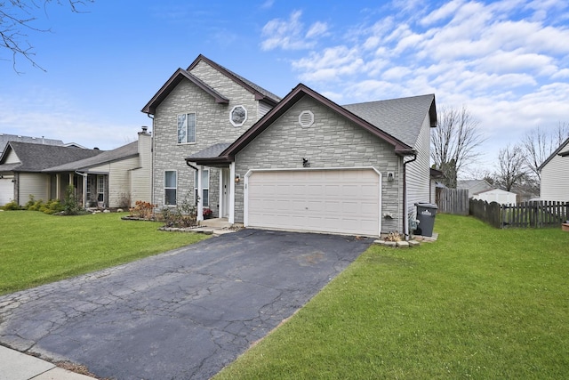 view of front facade featuring a front yard and a garage